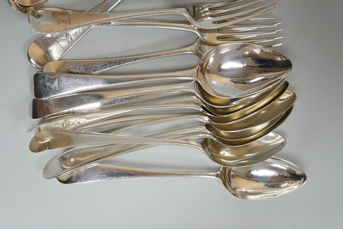 A harlequin part canteen of 19th century Old English pattern flatware, comprising thirty items, all with engraved crest, various dates and makers, 38.1oz.
